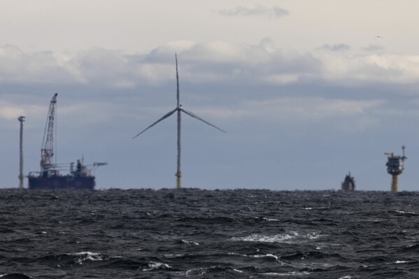 File - The first operating South Fork Wind Farm turbine is visible, December 7, 2023, east of Montauk Point, NY Unfounded claims about whales threatened by offshore wind have emerged as a flashpoint in the fight over the future of renewable energy. Have come.  (AP Photo/Julia Nikhinson, File)