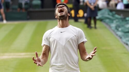 Spain's Carlos Alcaraz celebrates after beating Serbia’s Novak Djokovic to win the final of the men’s singles on day fourteen of the Wimbledon tennis championships in London, Sunday, July 16, 2023. (Victoria Jones/PA via AP)