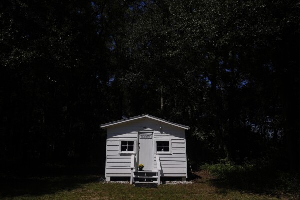 The Coffin Point Community Praise House is seen on Tuesday, Sept, 19, 2023, in St. Helena Island, S.C. Researchers estimate fewer than 30 historic Black towns are left, compared to more than 1,200 at the peak about a century ago. (AP Photo/Brynn Anderson)