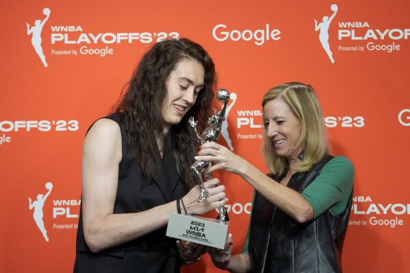 WNBA Commissioner Cathy Engelbert, right, presents New York Liberty forward Breanna Stewart with the league MVP trophy during a news conference Tuesday, Sept. 26, 2023, at Barclays Center in New York. (AP Photo/Mary Altaffer)
