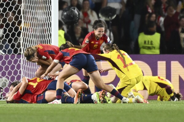 Spain's players celebrate as they defeated England after the Women's World Cup soccer final at Stadium Australia in Sydney, Australia, Sunday, Aug. 20, 2023. (AP Photo/Steve Markham)
