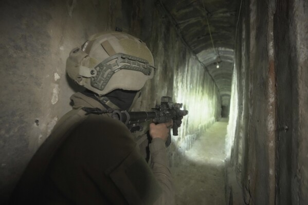 FILE - Israeli soldiers show the media an underground tunnel found underneath Shifa Hospital in Gaza City, Nov. 22, 2023. The U.S. is “confident” that Palestinian militant groups used Gaza's largest hospital to hold “at least a few” hostages seized during their bloody Oct. 7 attack and to house command infrastructure, an American intelligence assessment declassified Tuesday, Jan. 2, 2024, and shared by a U.S. official found. (AP Photo/Victor R. Caivano, File)