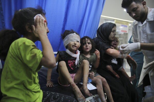 Palestinian children wounded in Israeli strikes are brought to Shifa Hospital in Gaza City on Wednesday, Oct. 11, 2023. (AP Photo/Ali Mahmoud)