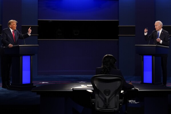 FILE - President Donald Trump, left, and Democratic presidential candidate former Vice President Joe Biden during the second and final presidential debate Oct. 22, 2020, at Belmont University in Nashville, Tenn. Unflattering portraits of both President Joe Biden and former President Donald Trump emerge clearly in a new poll by The Associated Press-NORC Center for Public Affairs Research, which asked an open-ended question about what comes to mind when people think of them. (AP Photo/Patrick Semansky, File)