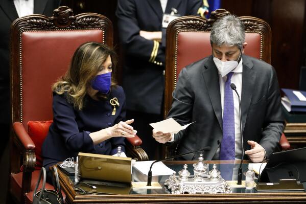 President of the Italian Senate Maria Elisabetta Alberti Casellati, left, and President of the Italian Chamber of Deputies Roberto Fico count ballots during a voting session in the Italian parliament, in Rome, Thursday, Jan. 27, 2022. The first rounds of voting in Italy's Parliament for the country's next president yielded an avalanche of blank ballots, as lawmakers and special regional electors failed to deliver a winner amid a political stalemate. (Remo Casilli/Pool photo via AP)