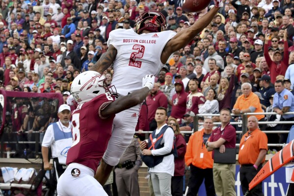 Boston College wide receiver Joseph Griffin Jr. (2) attempts to pull in a pass in the endzone but was thwarted by Florida State defensive back Renardo Green (8) during the second half of an NCAA college football game Saturday, Sept. 16, 2023 in Boston. (AP Photo/Mark Stockwell)