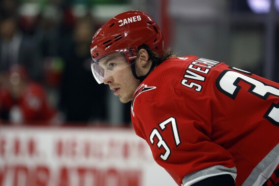 FILE - Carolina Hurricanes' Andrei Svechnikov (37) watches the puck during the third period of an NHL hockey game against the Philadelphia Flyers in Raleigh, N.C., Thursday, March 9, 2023. Svechnikov skated with teammates while wearing a yellow no-contact jersey to open preseason camp Thursday, Sept. 21, as he recovers from a serious knee injury that sidelined him late last season. (AP Photo/Karl B DeBlaker, File)