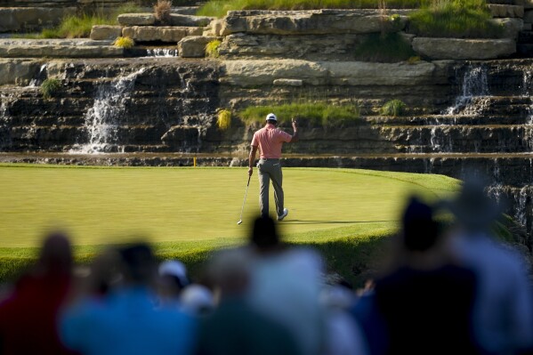 Tiger Woods waves after making a putt on the 13th hole during the first round of the PGA Championship golf tournament at the Valhalla Golf Club, Thursday, May 16, 2024, in Louisville, Ky. (AP Photo/Matt York)