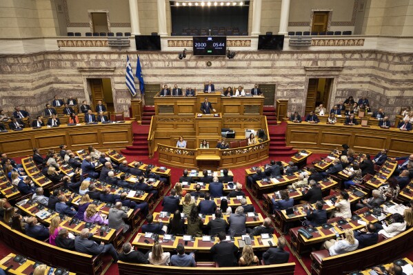 Greece's Prime Minister Kyriakos Mitsotakis addresses lawmakers during a parliament session in Athens, Greece, Saturday, July 8, 2023. The newly elected Greek government won a vote of confidence from the parliament, following a three-day debate. (AP Photo/Yorgos Karahalis)