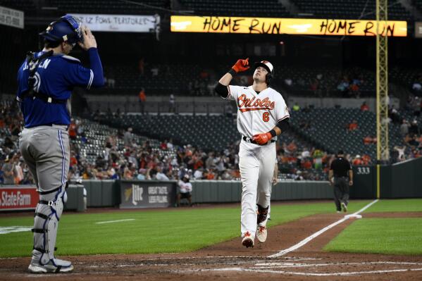 Baltimore Orioles' Ryan Mountcastle (6) celebrates after his home run as Toronto Blue Jays catcher Danny Jansen, left, looks on during the third inning of a baseball game, Monday, Aug. 8, 2022, in Baltimore. (AP Photo/Nick Wass)