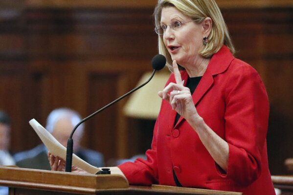 In this Feb. 26, 2019 photo, Speaker Pro-Tempore Jan Jones, R-Milton, speaks in favor of a bill to buy a new $150 million election system that includes a paper ballot printed with a ballot marking device. On Monday, Sept. 30, 2019 Jones joined the competition to replace retiring GOP U.S. Sen. Johnny Isakson.
 Jones says she has submitted an application to Republican Gov. Brian Kemp seeking appointment to Isakson’s seat. The 74-year-old Isakson recently announced that he will retire in December due to health issues. (Bob Andres/Atlanta Journal-Constitution via AP)