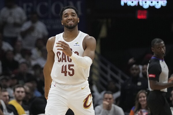 Cleveland Cavaliers' Donovan Mitchell reacts after a basket against the Boston Celtics during the first half of Game 3 of an NBA basketball second-round playoff series Saturday, May 11, 2024, in Cleveland. (AP Photo/Sue Ogrocki)