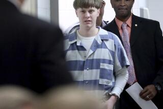 FILE - In this April 10, 2017, file photo, Dylann Roof enters the court room at the Charleston County Judicial Center to enter his guilty plea on murder charges in Charleston, S.C. White supremacist Roof on Tuesday, Jan. 28, 2020, appealed his federal convictions and death sentence in the 2015 massacre of nine black church members in South Carolina, arguing that he was mentally ill when he represented himself at his capital trial. (Grace Beahm/The Post And Courier via AP, Pool, File)