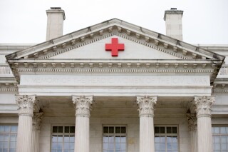 American Red Cross National Headquarters building, Friday, June 19, 2015, in Washington. Social media users are falsely claiming that the Red Cross is banning people who received COVID-19 vaccines from donating blood. (AP Photo/Andrew Harnik)
