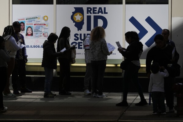 People line up to apply for Real ID at a Real ID Supercenter in downtown Chicago, Tuesday, May 6, 2025. (AP Photo/Kiichiro Sato)