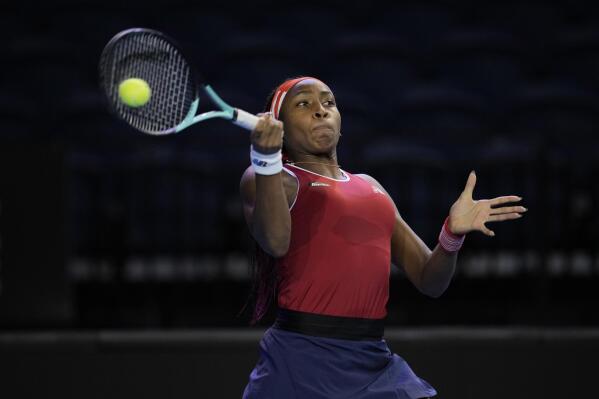 Coco Gauff of the U.S. returns a ball during a match against Magda Linette and Alicja Rosolska of Poland on the second day of the Billie Jean King Cup finals at Emirates Arena in Glasgow, Scotland, Thursday, Nov. 10, 2022. (AP Photo/Kin Cheung)