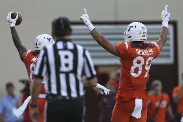 Virginia Tech's James Mitchell, left, and Drake Deluliis (89) celebrate Virginia Tech touchdown catch against North Carolina during the first of an NCAA college football game Friday, Sept. 3, 2021, in Blacksburg, Va. (Matt Gentry/The Roanoke Times via AP)