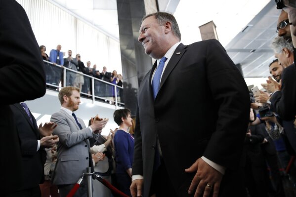 
              New Secretary of State Mike Pompeo greets State Department employees as he arrives at the State Department in Washington, Tuesday, May 1, 2018. (AP Photo/Jacquelyn Martin)
            