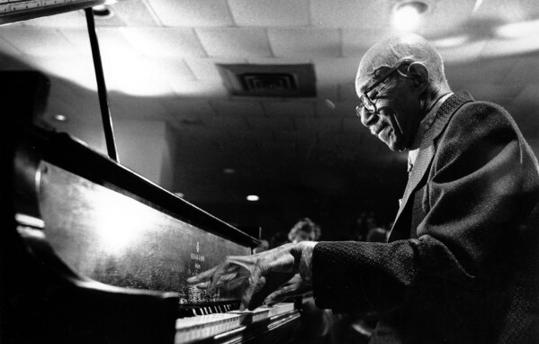 Veteran jazz pianist Eubie Blake performs during a suprise party for his 93rd birthday at New York's Waldorf Astoria Hotel on Feb. 7, 1976.  (APPhoto/Ray Stubblebine)