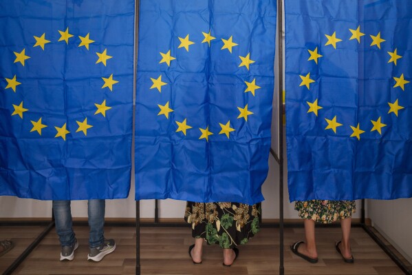 People vote in European and local elections in Baleni, Romania, Sunday, June 9, 2024. Voters across the European Union are going to the polls on the final day of voting for the European parliamentary elections to choose their representatives for the next five-year term. (AP Photo/Vadim Ghirda)