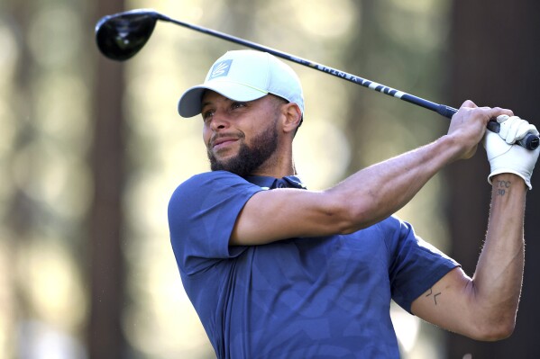 Stephen Curry watches a tee shot on the 16th hole during a practice round at American Century Championship golf tournament Wednesday, July 12, 2023, in Stateline, Nev. (Scott Strazzante/San Francisco Chronicle via AP)