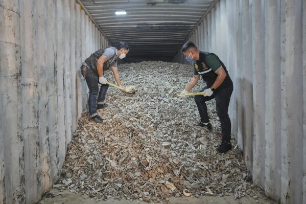 Thai officials show samples of illegally imported electronic waste from the United States which they said they seized at Bangkok Port during a press conference in Bangkok, Thailand, Wednesday, May 14, 2025. (AP Photo/Sakchai Lalit)