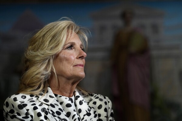 FILE - First lady Jill Biden waits to speak at the Library of Congress in Washington, Wednesday, April 19, 2023, during a reception with congressional members and spouses showcasing bipartisan support for cancer prevention and early detection. (AP Photo/Susan Walsh, File)