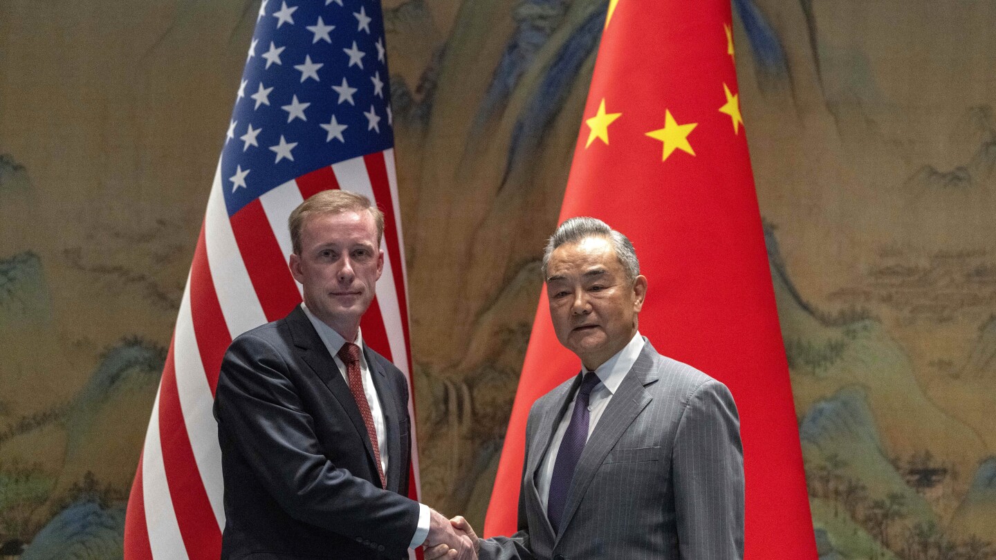 A top White House official says US and China are working to avoid conflict at talks in Beijing