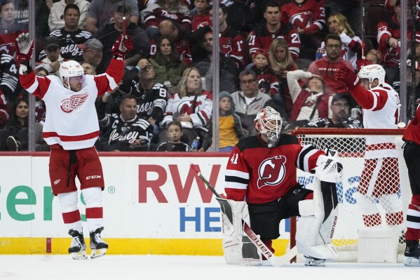 New Jersey Devils' Jesper Bratt (63) is congratulated for his goal against  the New York Rangers during the first period of an NHL preseason hockey  game Wednesday, Oct. 4, 2023, in Newark