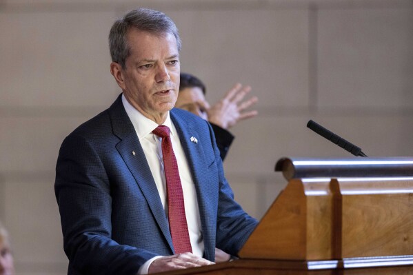 FILE - Nebraska Gov. Jim Pillen delivers his State of the State on Wednesday, Jan. 25, 2023, at the the state Capitol in Lincoln, Neb. A Nebraska judge on Friday, Aug. 11, 2023 rejected an effort to block a ban on abortions after 12 weeks of pregnancy and restrictions on gender-affirming surgery. Lancaster County District Court Judge Lori Maret sided with the state and allowed a law approved by the Nebraska Legislature earlier this year to remain in effect. (Anna Reed/Omaha World-Herald via AP, File)