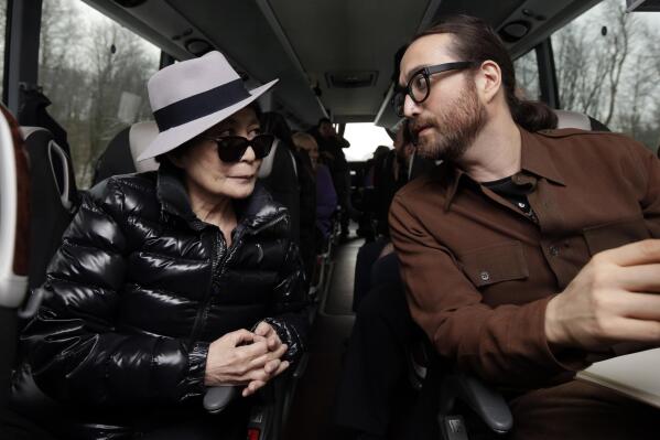 Yoko Ono, left, and her son Sean Lennon chat aboard a bus on the way to visit fracking sites in Pennsylvania Thursday, Jan. 17, 2013. They are touring natural-gas drilling sites in northeastern Pennsylvania and visiting with residents who say they've been harmed by the controversial extraction process known as fracking. (AP Photo/Richard Drew)