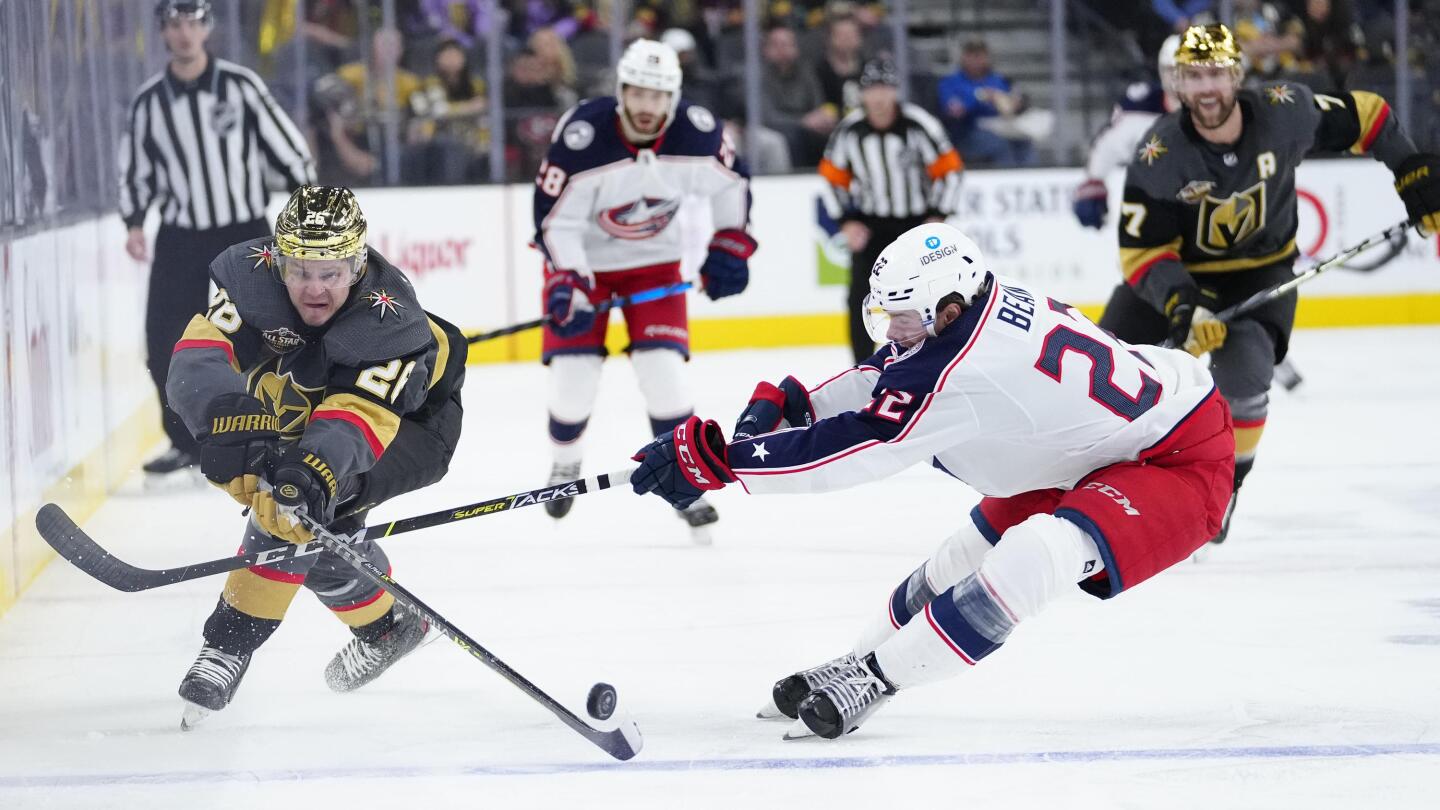 Golden Knights defenseman Dylan Coghlan (52) fights for a loose
