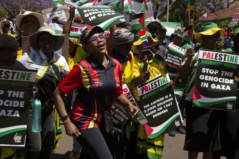 Pro-Palestinian supporters demonstrate at the entrance to the Israeli embassy in Pretoria, South Africa, Friday, Oct. 20, 2023. (AP Photo/Denis Farrell, File)