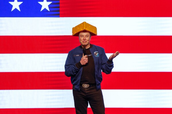 Elon Musk speaks at a town hall Sunday, March 30, 2025, in Green Bay, Wis. (AP Photo/Jeffrey Phelps)
