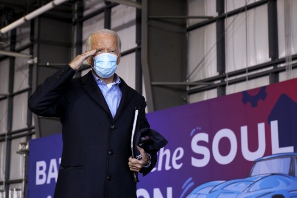 Democratic presidential candidate former Vice President Joe Biden salutes after speaking at a rally at Cleveland Burke Lakefront Airport, Monday, Nov. 2, 2020, in Cleveland. (AP Photo/Andrew Harnik)