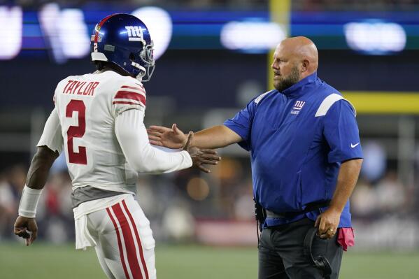 New York Giants quarterback Tyrod Taylor (2) celebrates his touchdown pass with coach Brian Daboll during the second half of the team's preseason NFL football game against the New England Patriots, Thursday, Aug. 11, 2022, in Foxborough, Mass. (AP Photo/Charles Krupa)