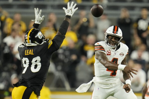 Cleveland Browns quarterback Deshaun Watson (4) throws over Pittsburgh Steelers defensive end DeMarvin Leal (98) during the first half of an NFL football game Monday, Sept. 18, 2023, in Pittsburgh. (AP Photo/Gene J. Puskar)
