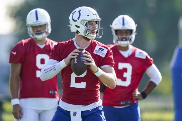 Indianapolis Colts quarterback Carson Wentz (2) throws during a drill during practice at the NFL team's football training camp in Westfield, Ind., Tuesday, Aug. 24, 2021. (AP Photo/Michael Conroy)