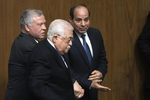 Egyptian President Abdel-Fattah el-Sissi, right, greets Palestinian President Mahmoud Abbas, center, and King Abdullah II of Jordan, during a conference to support Jerusalem at the Arab League headquarters in Cairo, Egypt, Sunday, Feb. 12, 2023. (AP Photo/Amr Nabil)