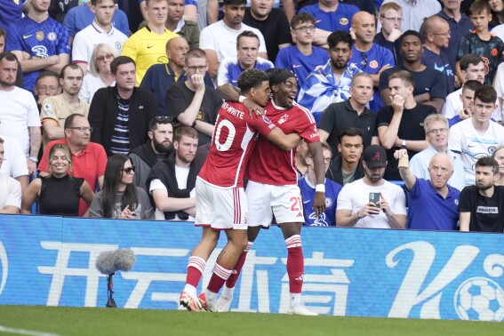 Nottingham Forest's Anthony Elanga, right, celebrates with teammate Nottingham Forest's Morgan Gibbs-White after scoring during the English Premier League soccer match between Chelsea and Nottingham Forest at Stamford Bridge stadium in London, Saturday, Sept. 2, 2023. (AP Photo/Kirsty Wigglesworth)