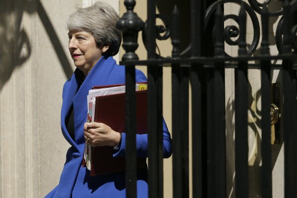 Britain's Prime Minister Theresa May leaves 10 Downing Street, for the House of Commons to attend Prime Minister's Questions in London, Wednesday, July 24, 2019. Boris Johnson will replace May as Prime Minister later Wednesday, following her resignation last month after Parliament repeatedly rejected the Brexit withdrawal agreement she struck with the European Union. (AP Photo/Tim Ireland)