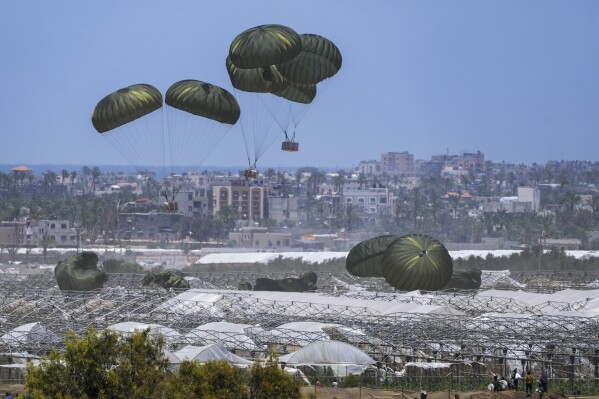 FILE - An aircraft airdrops humanitarian aid over Khan Younis, Gaza Strip, May 30, 2024. (AP Photo/Abdel Kareem Hana, File)