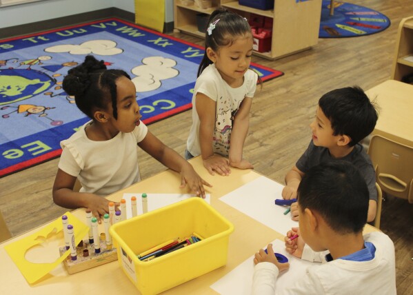 Children color at the KinderCare Child Development center on April 18, 2024, in Las Vegas. Just under 100 children of employees were enrolled at the The Venetian Las Vegas' center as of mid-April. (Jackie Valley/The Christian Science Monitor via AP)