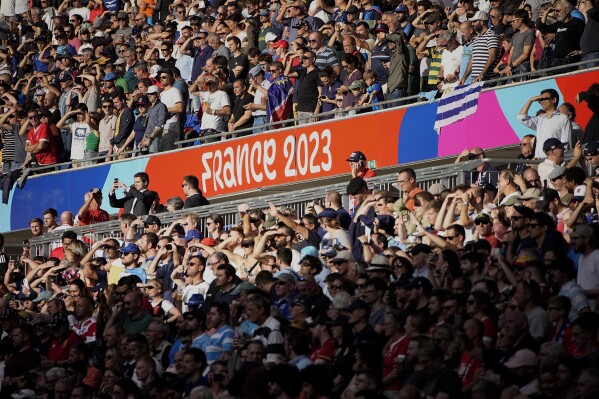 Fans attend the Rugby World Cup Pool A match between Uruguay and Namibia at the OL Stadium in Lyon, France, Wednesday, Sept. 27, 2023. (AP Photo/Laurent Cipriani)