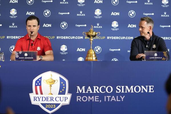 United States Captain Zach Johnson, left, and European Captain Luke Donald attend a press conference on the occasion of The Year to Go event in Rome, Tuesday, Oct. 4, 2022. The Marco Simone course of Guidonia Montecelio, near Rome, will host the 2023 Ryder Cup. (AP Photo/Alessandra Tarantino)