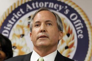 FILE - In this June 22, 2017 file photo, Texas Attorney General Ken Paxton speaks at a news conference in Dallas. A Texas hospital's care for transgender minors is being investigated by Paxton, who said Friday, May 5, 2023, he's seeking evidence of alleged “potentially illegal activity” but did not elaborate. (AP Photo/Tony Gutierrez, File)