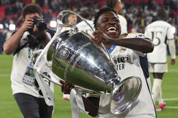 Real Madrid's Vinicius Junior celebrates at the end of the Champions League final soccer match between Borussia Dortmund and Real Madrid at Wembley stadium in London, Saturday, June 1, 2024. Real Madrid won 2-0. (AP Photo/Ian Walton)