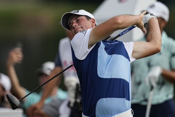Viktor Hovland, of Norway, hits off the sixth tee during the third round of the Tour Championship golf tournament, Sunday, Aug. 27, 2023, in Atlanta. (AP Photo/Mike Stewart)