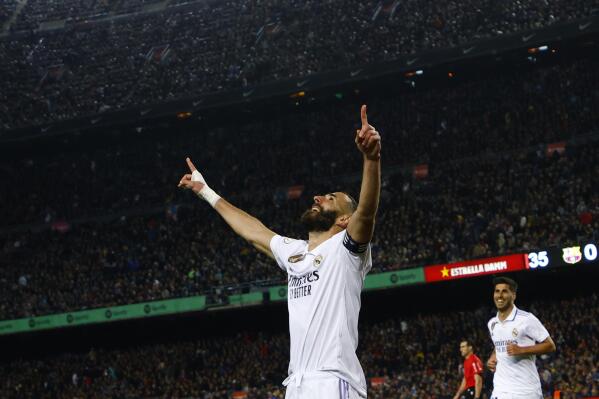 Real Madrid's Karim Benzema celebrates after scoring his side's fourth goal during the Spanish Copa del Rey semifinal, second leg soccer match between Barcelona and Real Madrid at the Camp Nou stadium in Barcelona, Spain, Wednesday, April 5, 2023. (AP Photo/Joan Monfort)