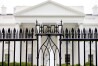 FILE - The White House is visible through the fence at the North Lawn in Washington, on June 16, 2016. A driver died Saturday night, May 4, 2024 after crashing a vehicle into a gate at the White House, authorities said. (AP Photo/Andrew Harnik, File)